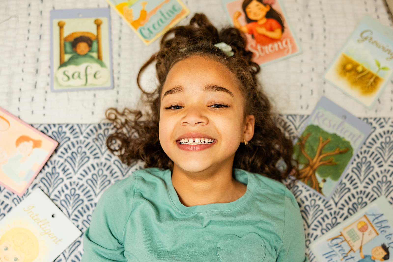 Child smiling through the Magic Mirror affirmation chart